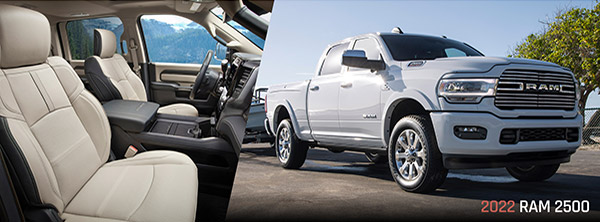 Image of a white 2022 Ram 2500 at a lakeside boat launch. | Image of the interior of the Ram 2500 showing the front seats and driver control area.